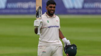 rehan ahmeed walking with a bat in his hand