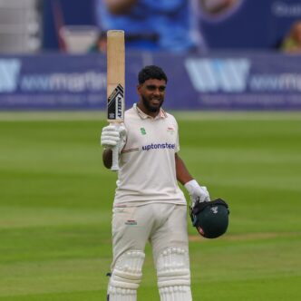 rehan ahmeed walking with a bat in his hand
