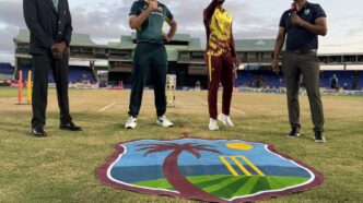 west indies and australian cricket captains standing on the ground for pre-match toss